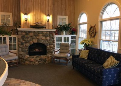 QC Dental Docs, P.C. lobby with fireplace and couch